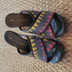 Diane Von Furstenberg wedge sandals.  Textile strap, wood heel.
